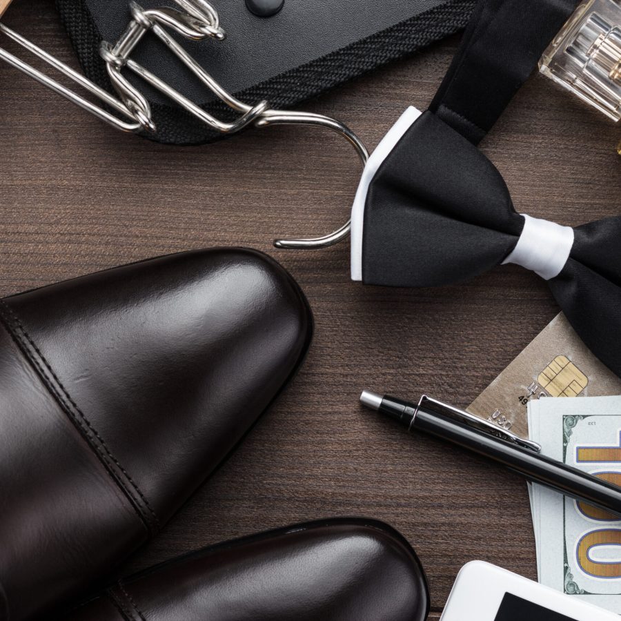 masculine accessories on the brown wooden table