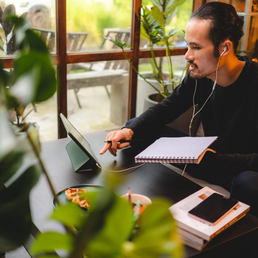 young man person using computer laptop or tablet for work and learning online communication from home, cyberspace education technology for business people or student using to work, hipster businessman